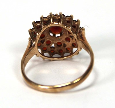 Lot 600 - A 9ct yellow gold cluster ring set three tiers...