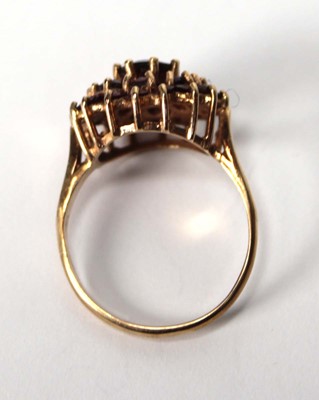 Lot 600 - A 9ct yellow gold cluster ring set three tiers...
