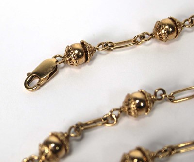 Lot 601 - A 9ct yellow gold bead necklace of Eastern...