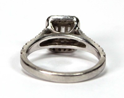 Lot 603 - A platinum halo cluster ring set baguette and...