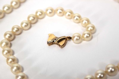Lot 604 - A single strand cultured pearl necklace with...