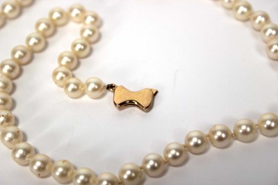 Lot 604 - A single strand cultured pearl necklace with...