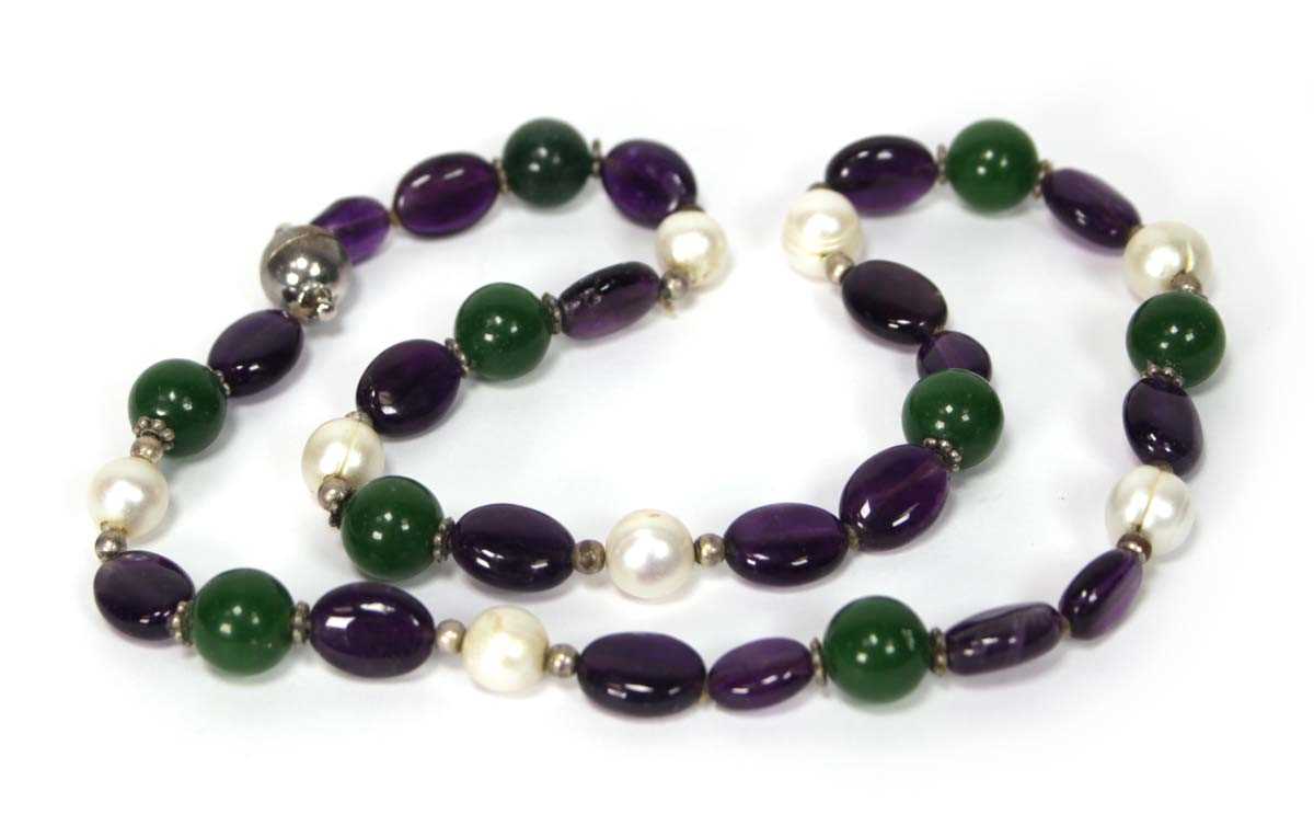 Lot 607 - A single strand bead necklace set cultured...