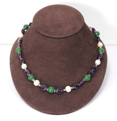 Lot 607 - A single strand bead necklace set cultured...