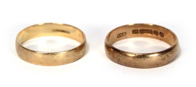 Lot 611 - A 9ct yellow gold wedding band, London 1959,...