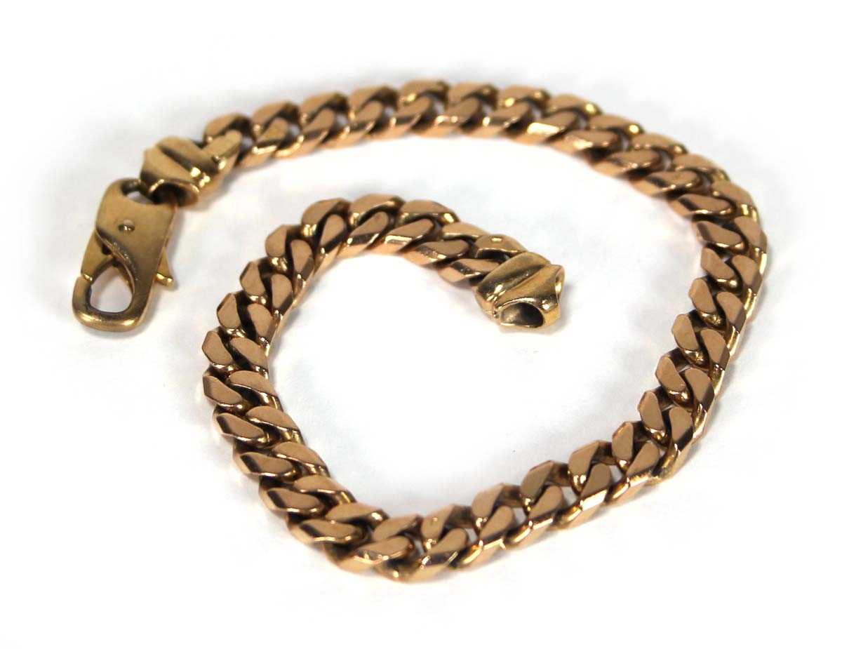 Lot 613 - A 9ct yellow gold flat curblink bracelet with...