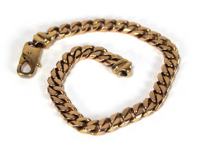 Lot 613 - A 9ct yellow gold flat curblink bracelet with...