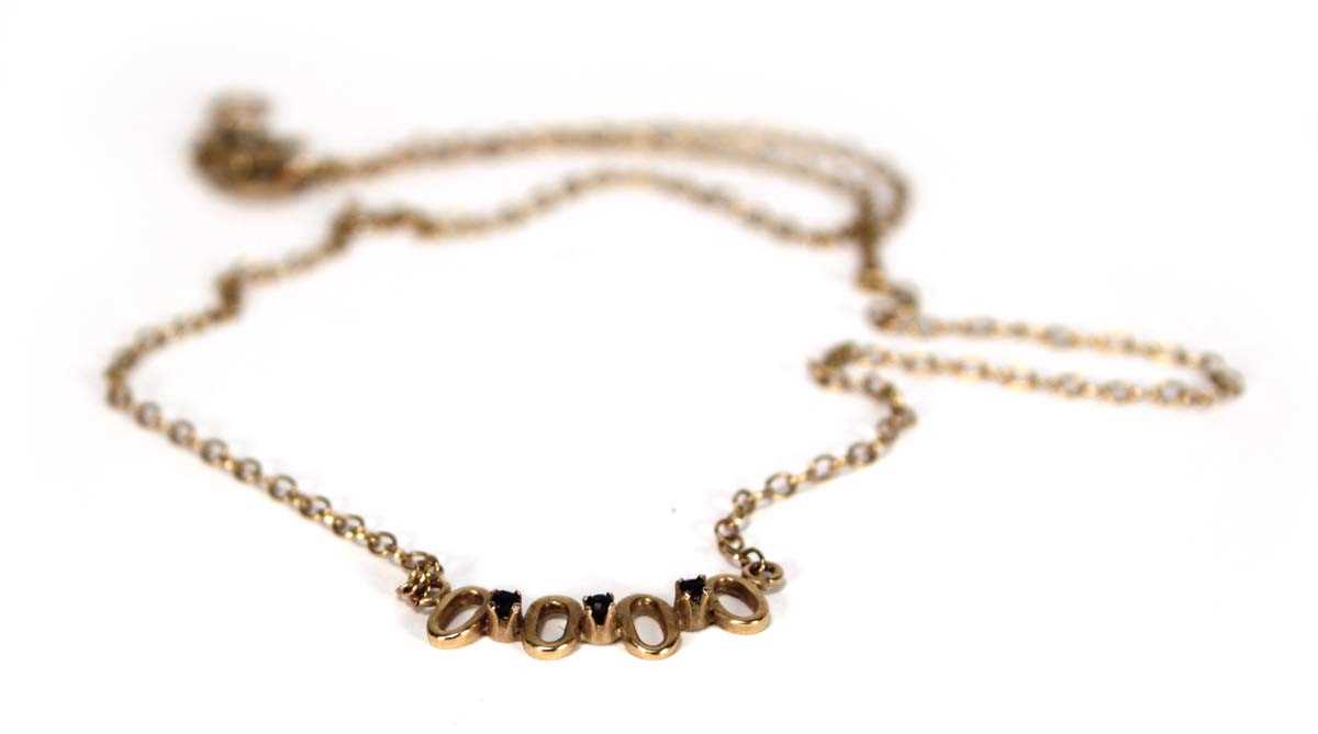 Lot 617 - A 9ct yellow gold fine chainlink necklace set...