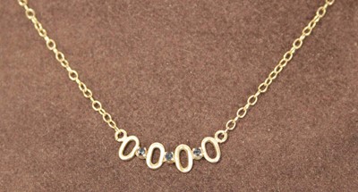 Lot 617 - A 9ct yellow gold fine chainlink necklace set...