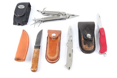 Lot 1019 - A Leatherman Charge, Victorinox Swiss Army...