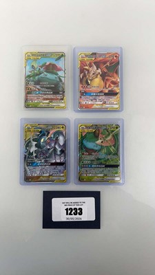 Lot 1233 - (4) Top Loaded Chinese Pokémon TCG Tag Team...