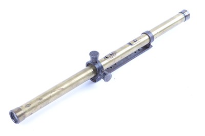 Lot 16 - A 4x brass rifle scope, the mount stamped...