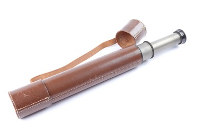 Lot 17 - A leather bound three-draw telescope with covers
