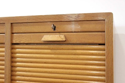 Lot 1 - A 1950/60's oak double-tambour cabinet with...