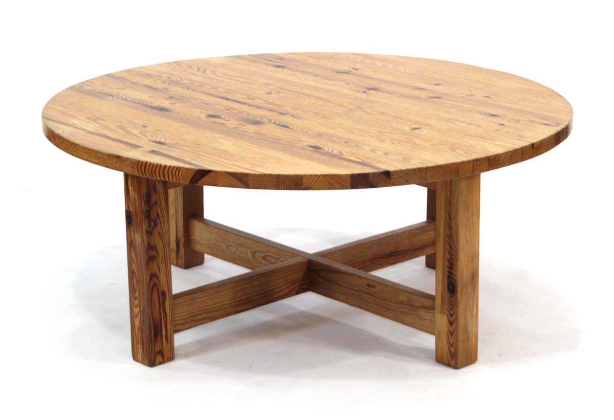 Lot 9 - A Scandinavian circular pine coffee table on...