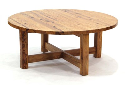 Lot 9 - A Scandinavian circular pine coffee table on...