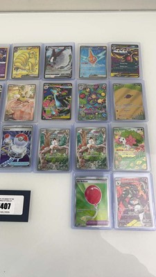 Lot 1407 - Approx. 25 Top Loaded Pokémon cards from...