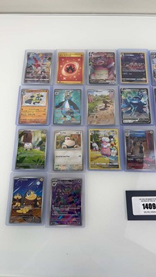 Lot 1409 - Approx. 25 Top Loaded Pokémon cards from...