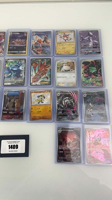 Lot 1409 - Approx. 25 Top Loaded Pokémon cards from...