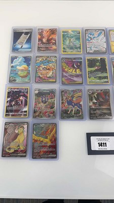 Lot 1411 - Approx. 25 Top Loaded Pokémon cards from...