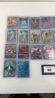 Lot 1412 - Approx. 25 Top Loaded Pokémon cards from...