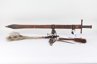 Lot 1047 - Tribal sword, dagger and fly whisk