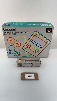 Lot 1074 - Nintendo Super Famicon in box together with...