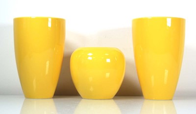 Lot 138 - A set of three Ikea canary yellow vases, max h....