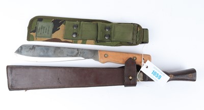 Lot 1059 - Military Panga and a machete, each with sheath