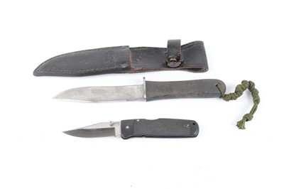 Lot 1061 - An SOG sheath knife and folding pocket knife