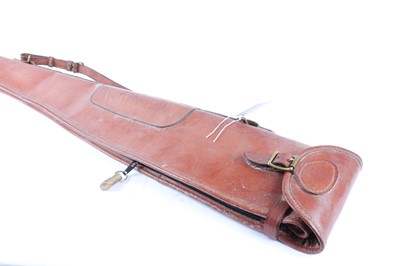 Lot 1323 - A stout leather gun slip, 50 ins overall