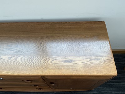Lot 61 - An Ercol elm Windsor Range sideboard, the...