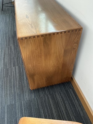 Lot 61 - An Ercol elm Windsor Range sideboard, the...