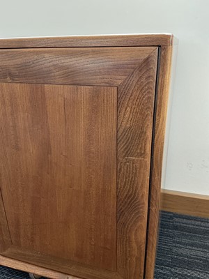 Lot 61 - An Ercol elm Windsor Range sideboard, the...
