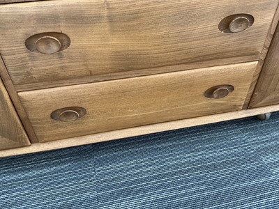 Lot 61 - An Ercol elm Windsor Range sideboard, the...
