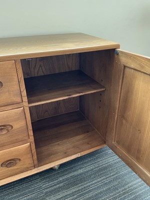 Lot 61 - An Ercol elm Windsor Range sideboard, the...