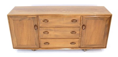 Lot 61 - An Ercol elm Windsor Range sideboard, the...