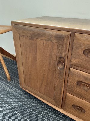 Lot 61 - An Ercol elm Windsor Range sideboard, the...