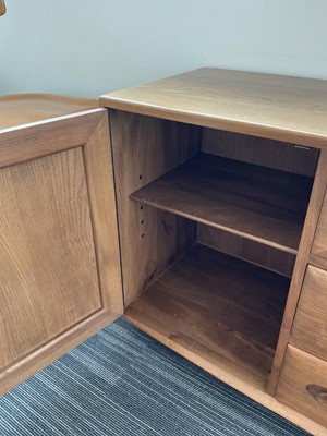 Lot 61 - An Ercol elm Windsor Range sideboard, the...