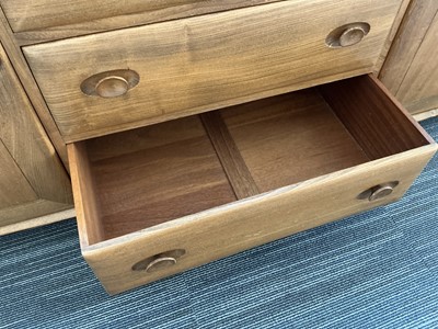 Lot 61 - An Ercol elm Windsor Range sideboard, the...