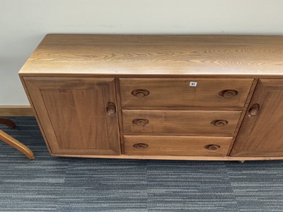 Lot 61 - An Ercol elm Windsor Range sideboard, the...