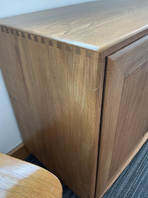 Lot 61 - An Ercol elm Windsor Range sideboard, the...