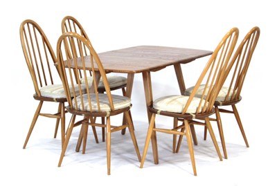 Lot 64 - An Ercol elm drop-leaf dining table on beech...