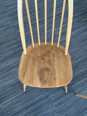Lot 64 - An Ercol elm drop-leaf dining table on beech...