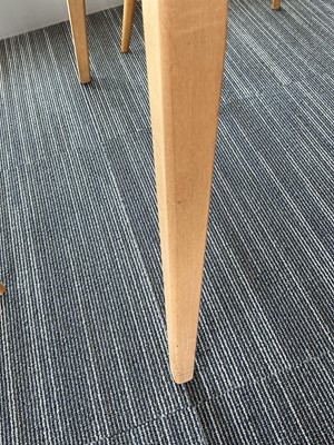 Lot 64 - An Ercol elm drop-leaf dining table on beech...