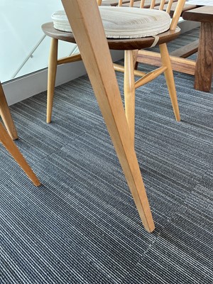 Lot 64 - An Ercol elm drop-leaf dining table on beech...