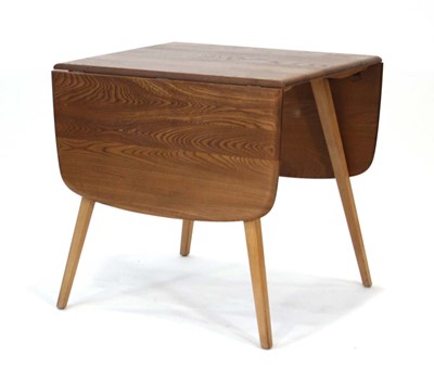 Lot 64 - An Ercol elm drop-leaf dining table on beech...