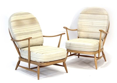 Lot 65 - A pair of Ercol elm and beech Model 305...