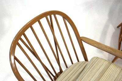 Lot 65 - A pair of Ercol elm and beech Model 305...