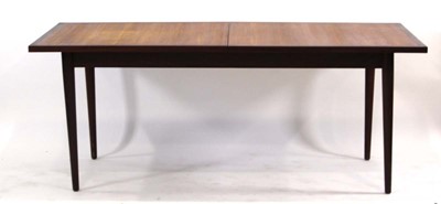 Lot 20 - A 1970's teak and crossbanded extending dining...